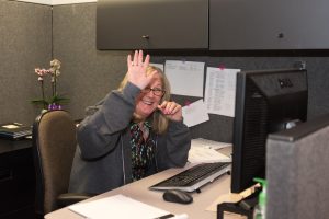 ACT employee waving