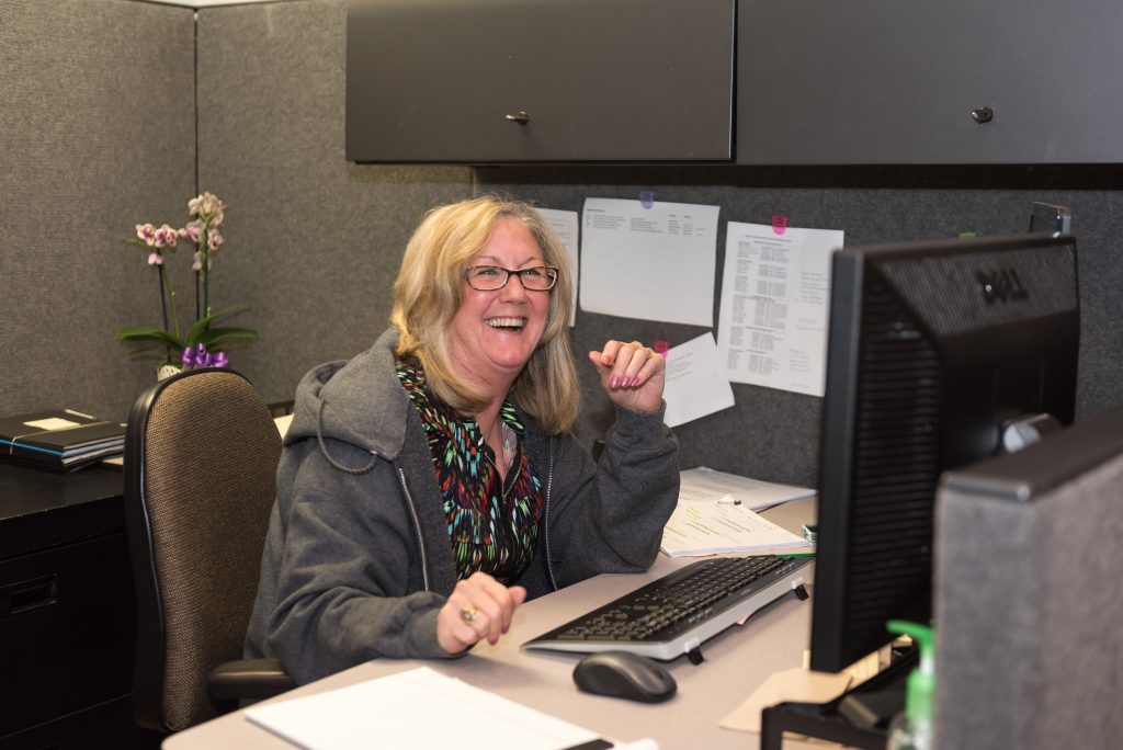 ACT employee at desk