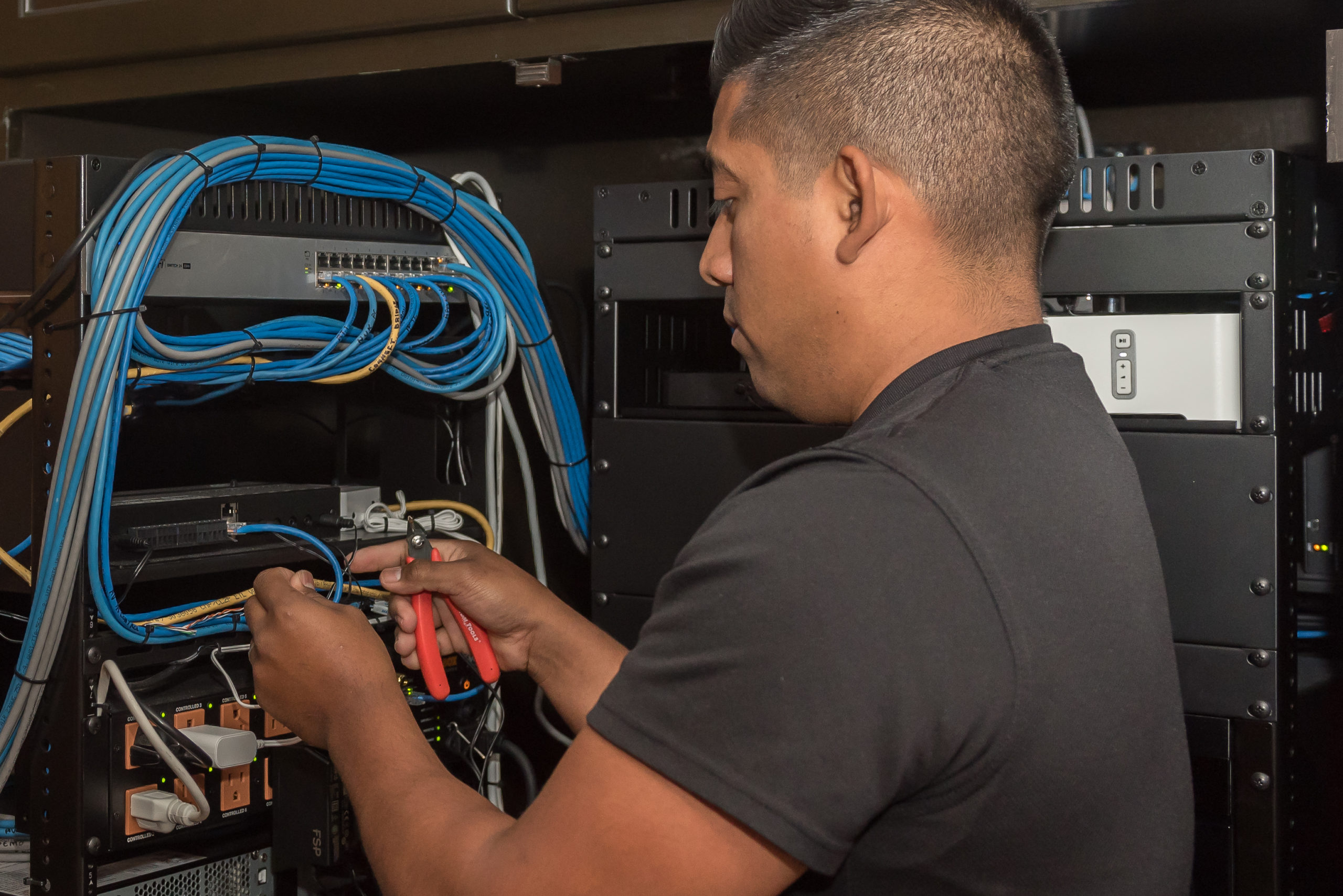 ACT employee working on hard wired network