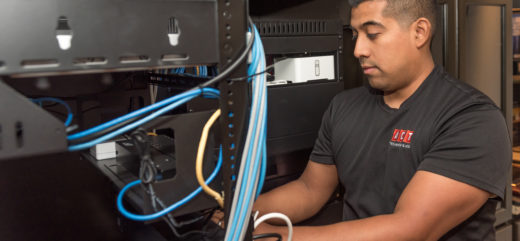 ACT Security technician working on managed IT network